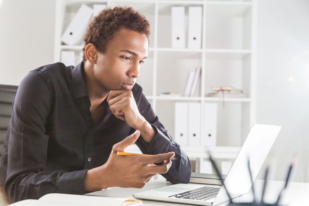 A man studying on his laptop