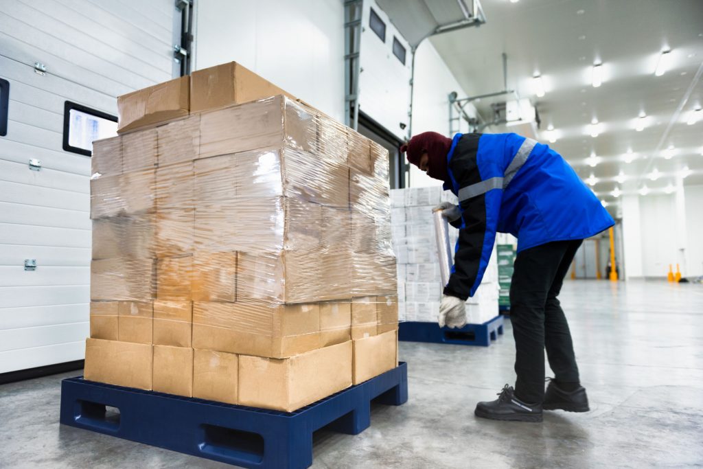 Man with goods on a pallet