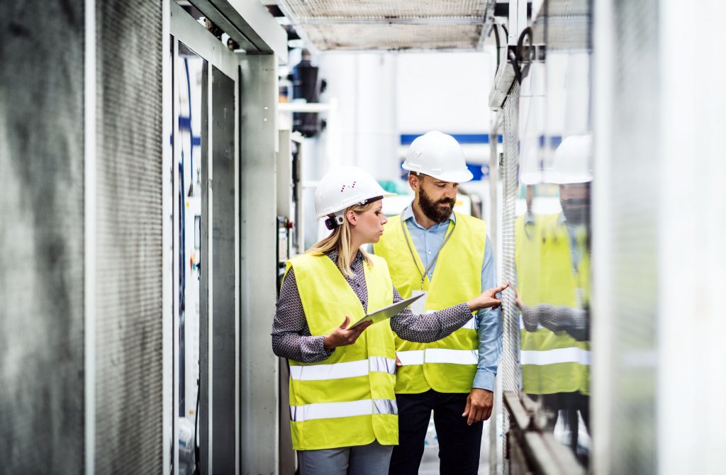 People talking and working in a factory